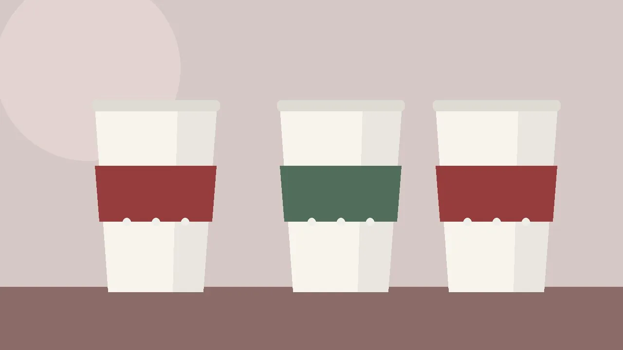 Three cups wearing red and green winter patterned sleeves